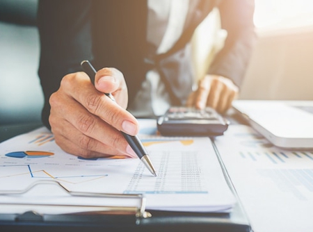 Accounting documents, calculator and financial records